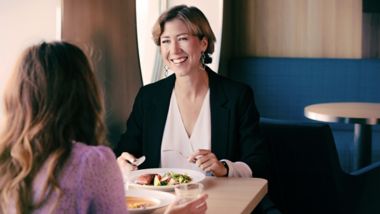 Women enjoying a meal in the restaurant onboard