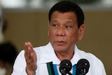 Philippines President Rodrigo Duterte gestures during Change of Command ceremonies.