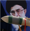 A Yaser missile is displayed in front of a portrait of Iran&#8217;s Supreme Leader Ayatollah Ali Khamenei during a military parade in Tehran on April 18, 2013.  AP