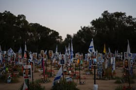Photos of hostages at the site of the Nova festival, where people were killed and kidnapped during the Oct. 7 attack by Hamas gunmen, in Reim, southern Israel. (Hannah McKay/Reuters)